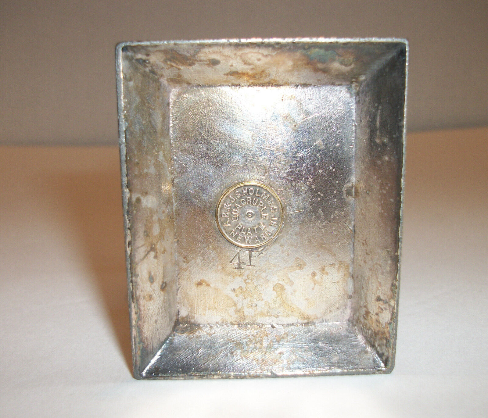 2 female head busts with ring on top. Holmes S.P. Co. 41b