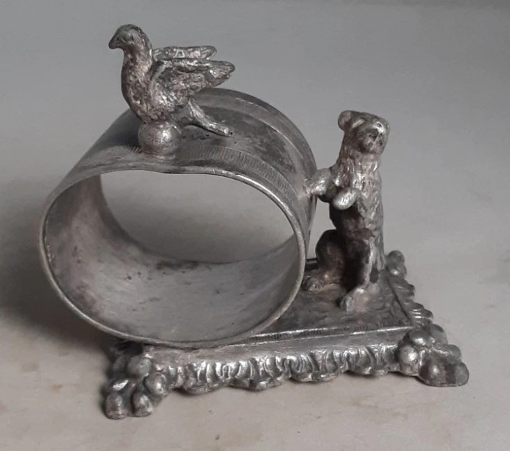 Dog and Bird on a typical Barbour Silver Company base. marked Barbour but no number.