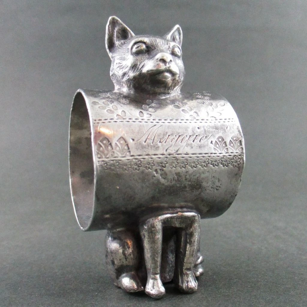 cat figural napkin ring, no glass eyes. I have many with glass eyes. attributed to Wilcox Siver Plate Co., unmarked.