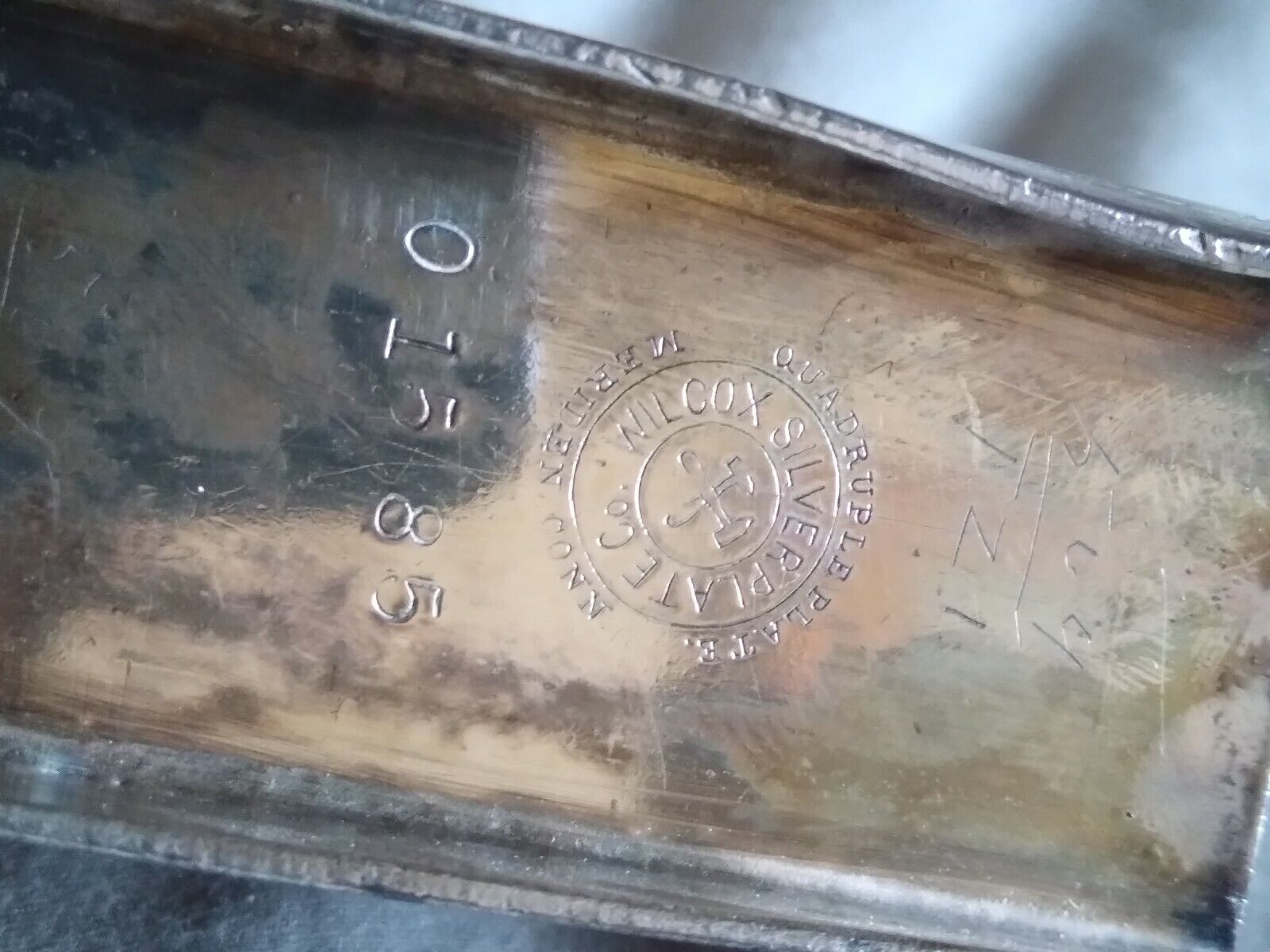 Large chick with triangular shapped ring. The base also looks like a sled. Wilcox 01585