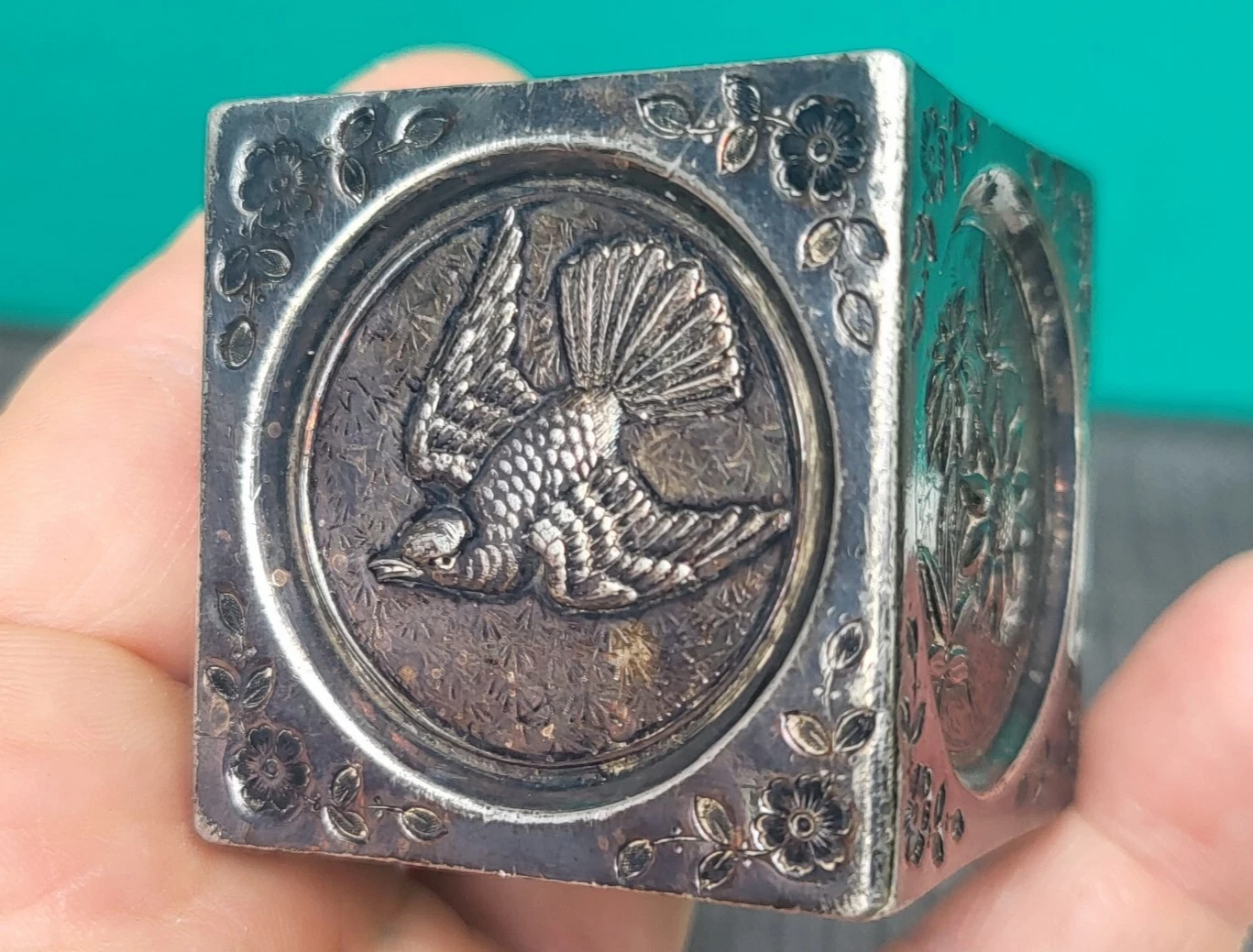 embrossed cube shaped napkin ring unmarked