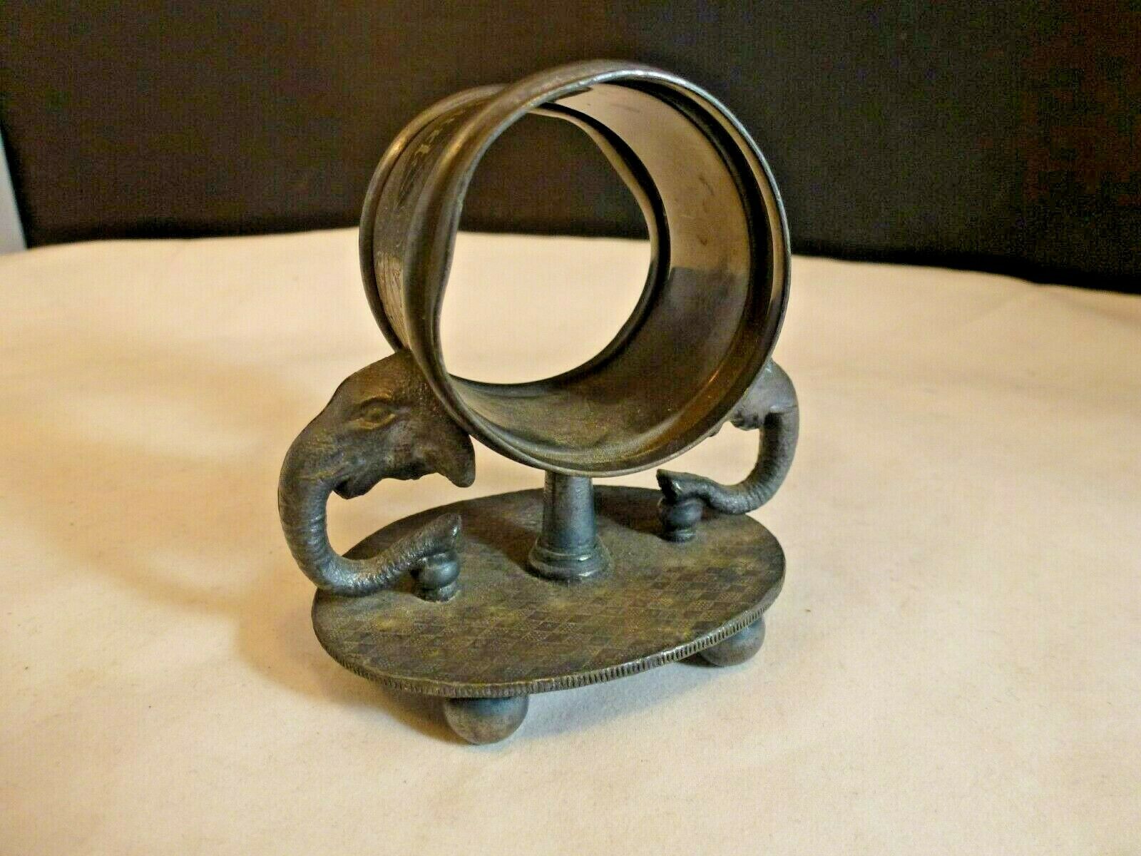 2 elephant heads. Tufts 1567