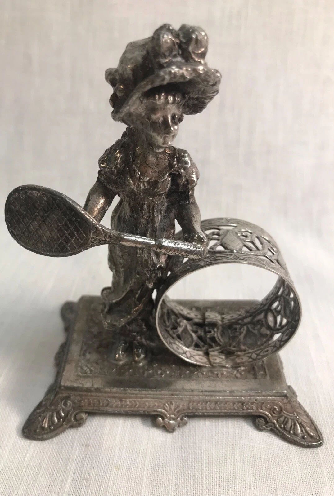 4 FAKE Tufts figural napkin rings. All marked Tufts 1161. Same base.