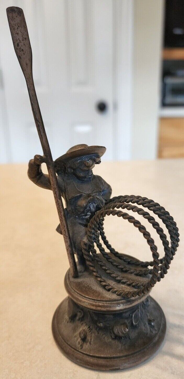 Meriden Silverpalte Co. 294. Kate Greenaway sailor with oar and rope forming the ring.