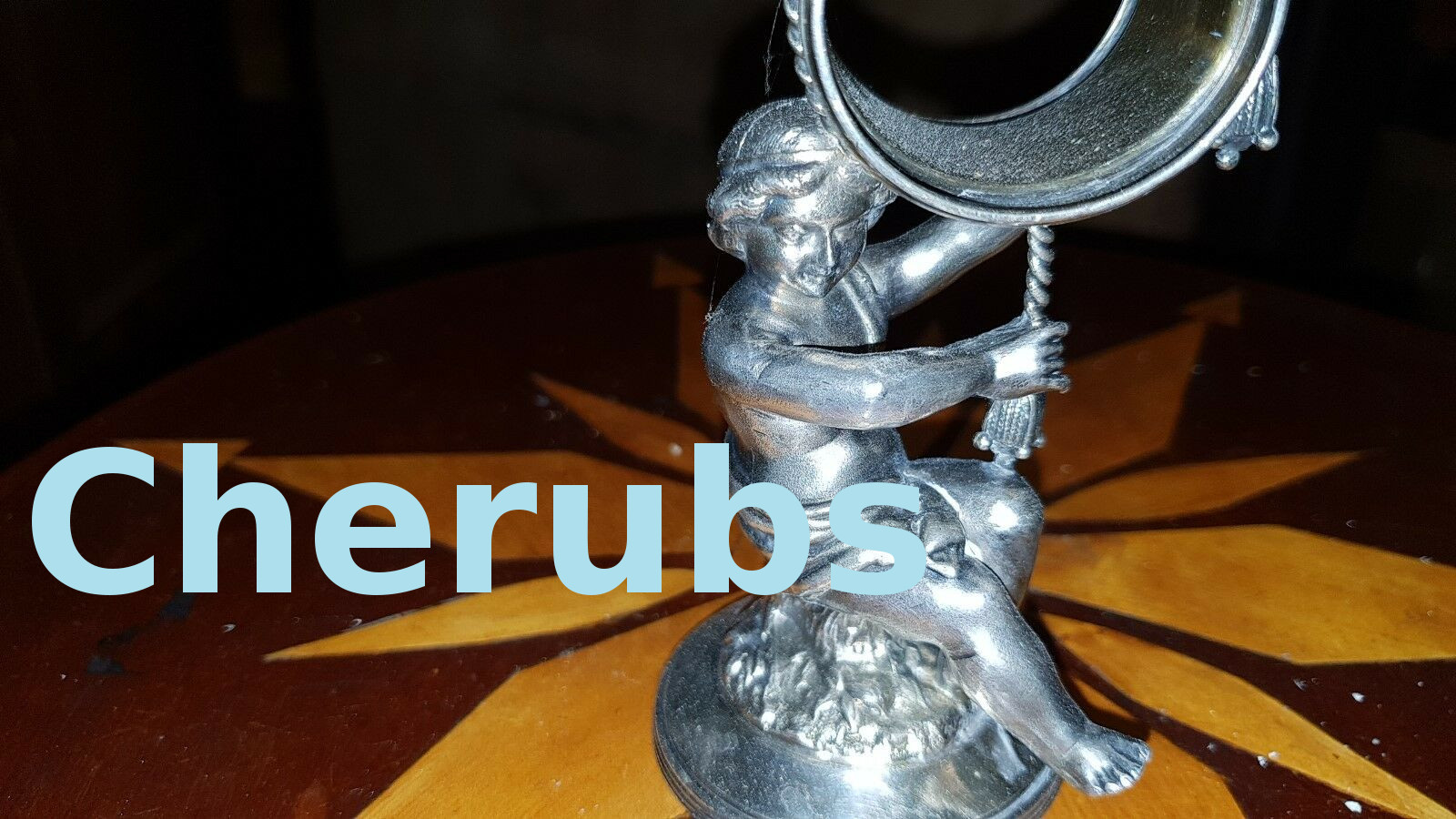 Cherub figural napkin rings